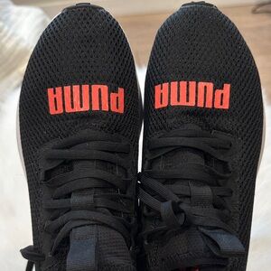 Puma Cell Vive Bright running sneakers in black, high-risk red, and white.